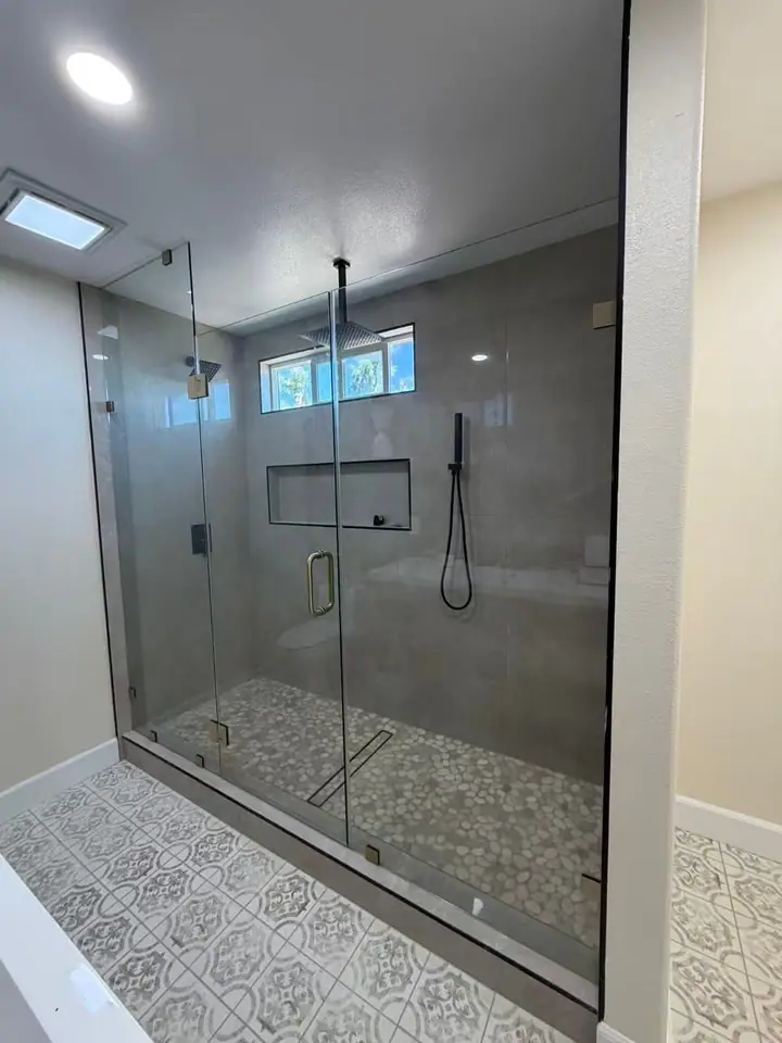Extra-wide floor-to-ceiling hinged enclosure installed by Merlord (photo 1 of 2)