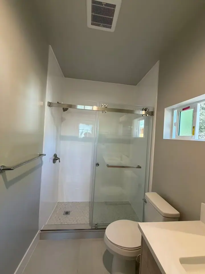 Double sliding door in brushed nickel installed by Merlord