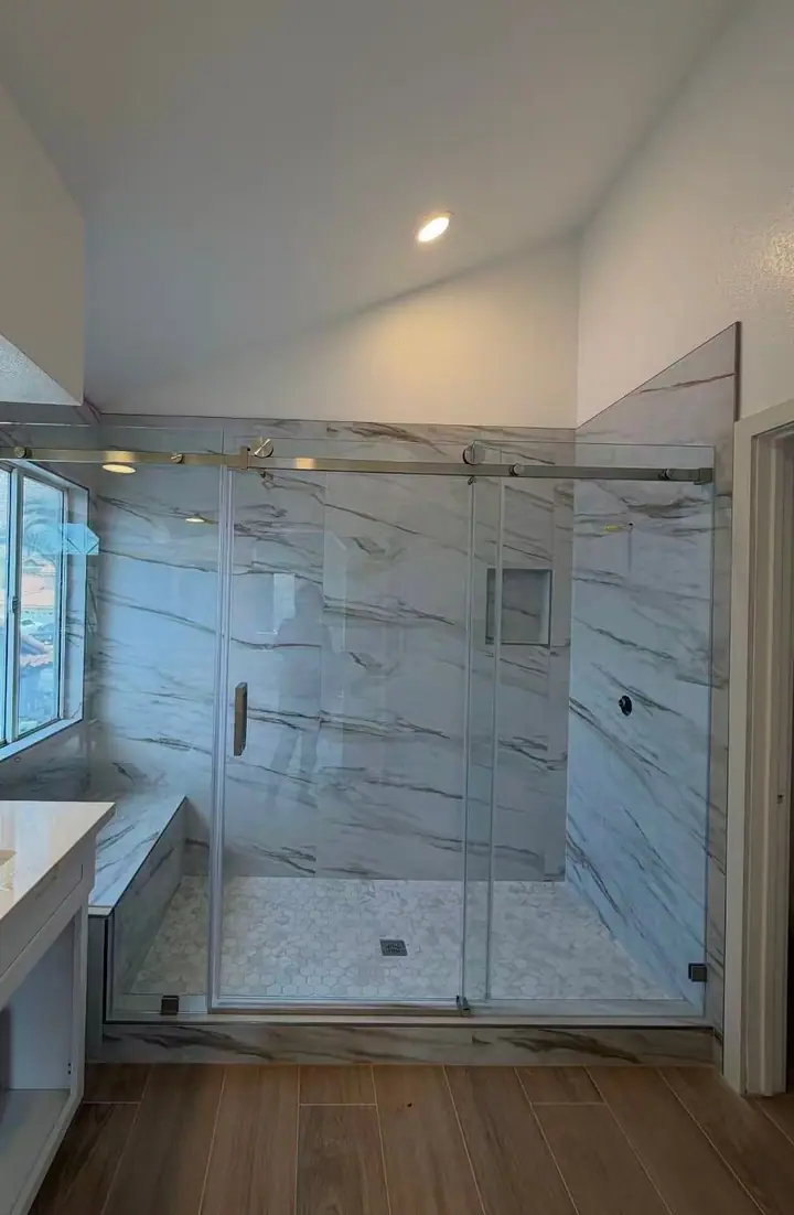 Long sliding door against marble tile installed by Merlord