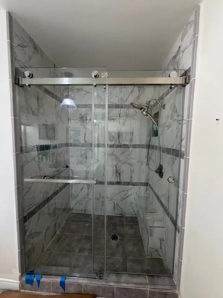 Sliding door with brushed nickel rail installed by Merlord