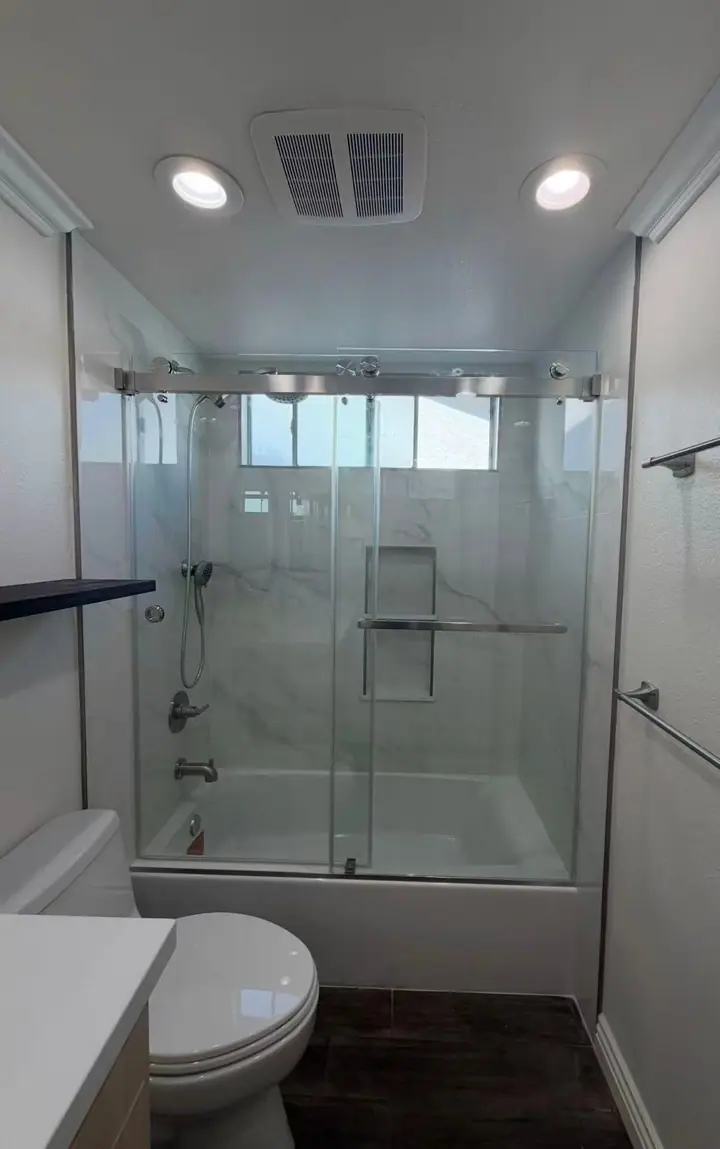 Double sliding doors over a bathtub installed by Merlord