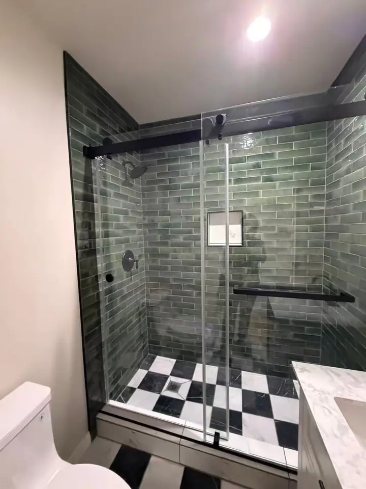 Black sliding door with checkerboard floor installed by Merlord