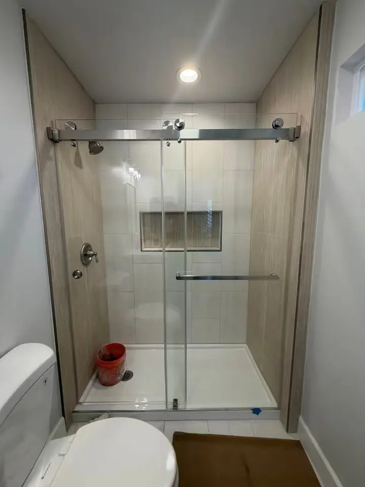 Double sliding door in brushed nickel installed by Merlord